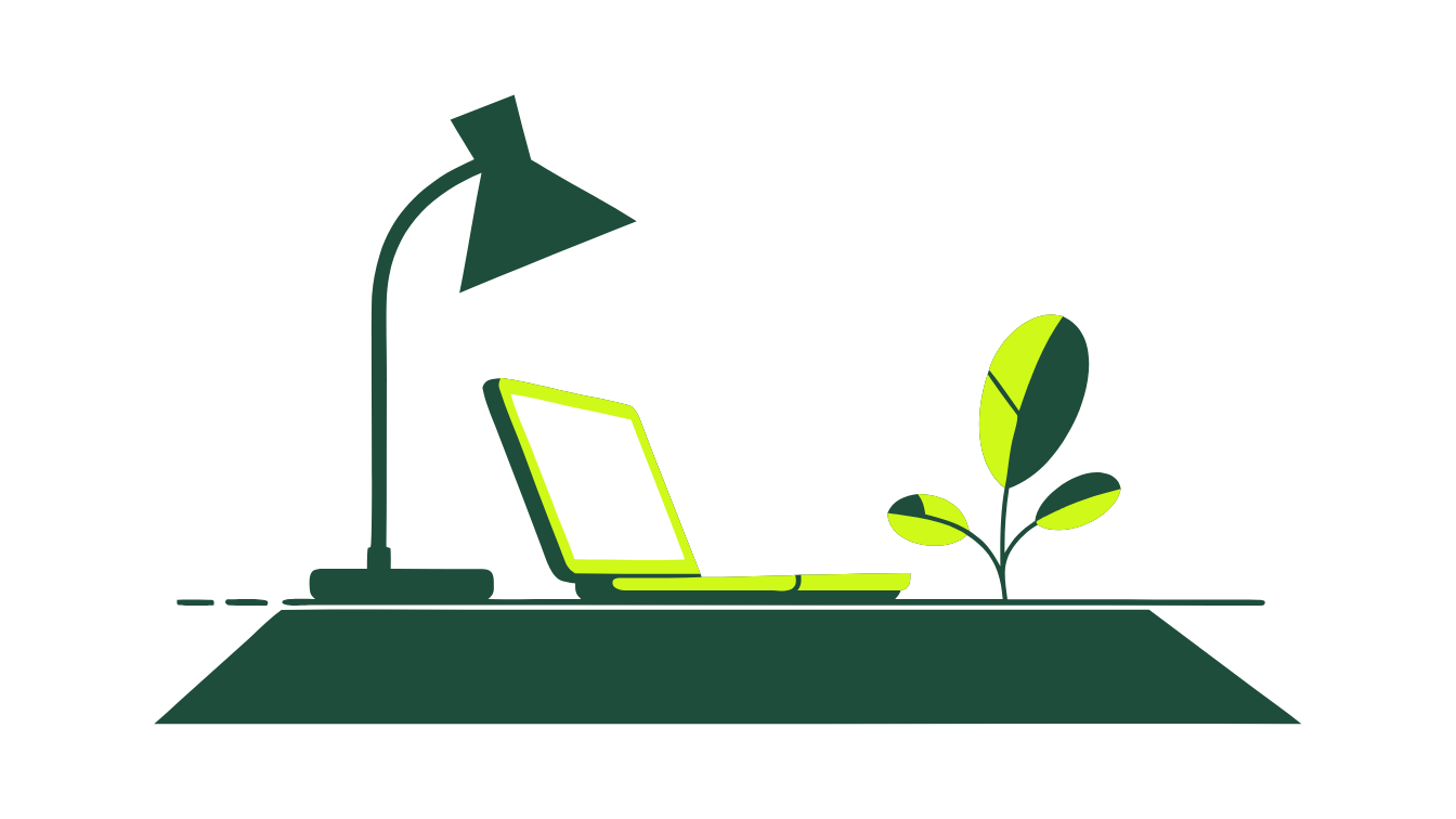 A desk lamp spotlighting a small laptop